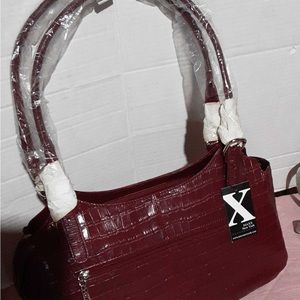 * Wine MAAX croco embossed leather zip-top bag. Wine. Measures 14"W x 8"H.